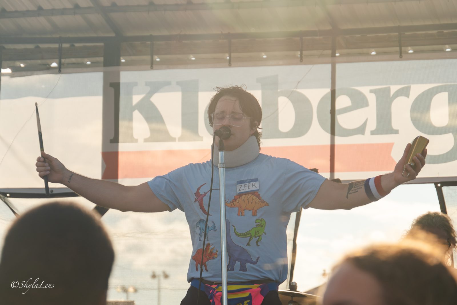 Performer on stage with arms outstretched