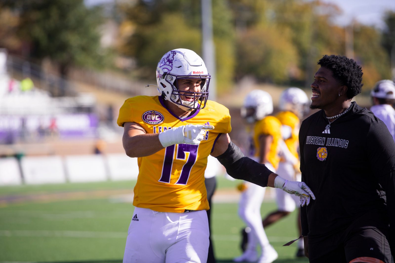 A player celebrating on the sideline moments after a play
